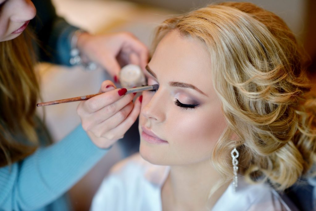 Make-up Wedding makeup artist making a make up for bride